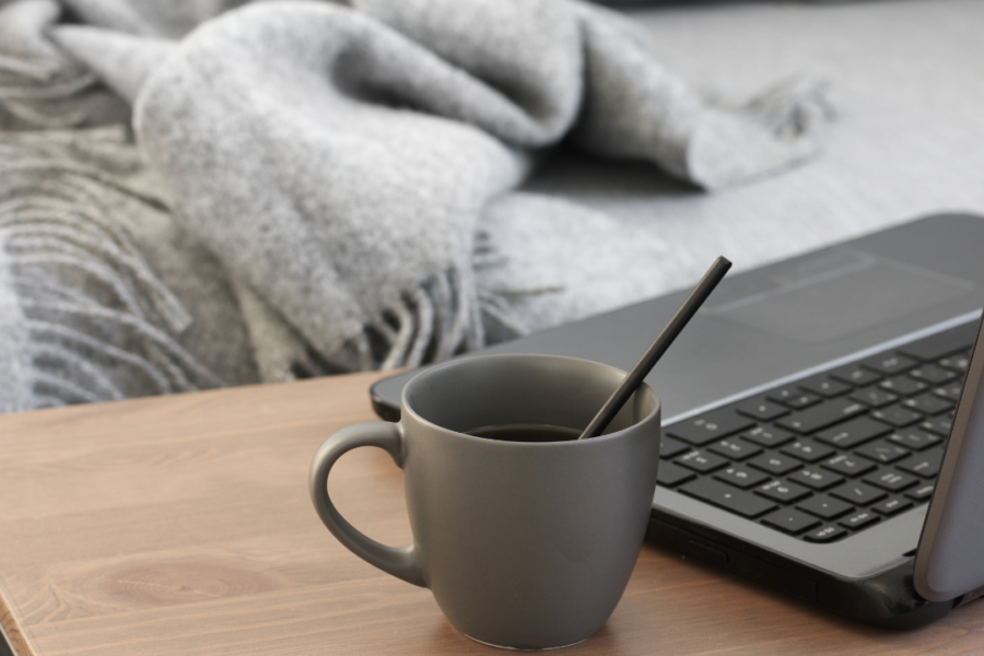 Computer and mug on table
